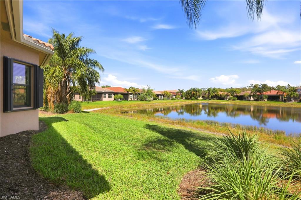 11505 Summerview Way Fort Myers, FL 33913 - Photo 42 of 50 a view of a lake with houses in the back