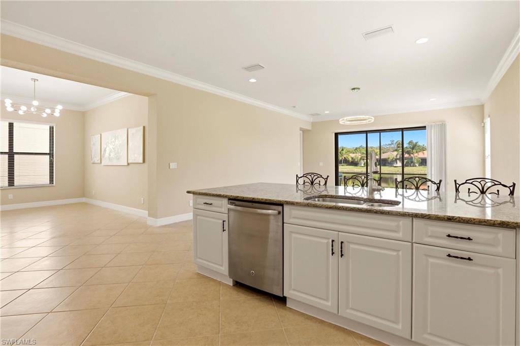 11505 Summerview Way Fort Myers, FL 33913 - Photo 6 of 50 a kitchen with granite countertop white cabinets and white appliances