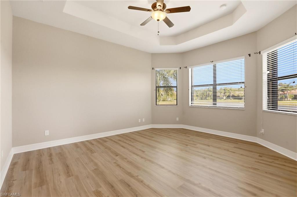 11505 Summerview Way Fort Myers, FL 33913 - Photo 10 of 50 wooden floor in an empty room with a window