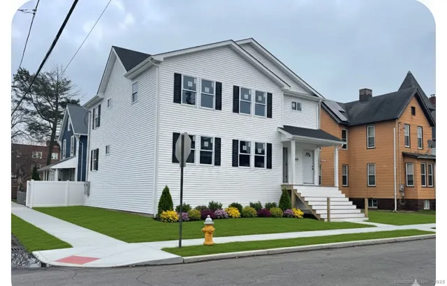 a front view of a house with a yard