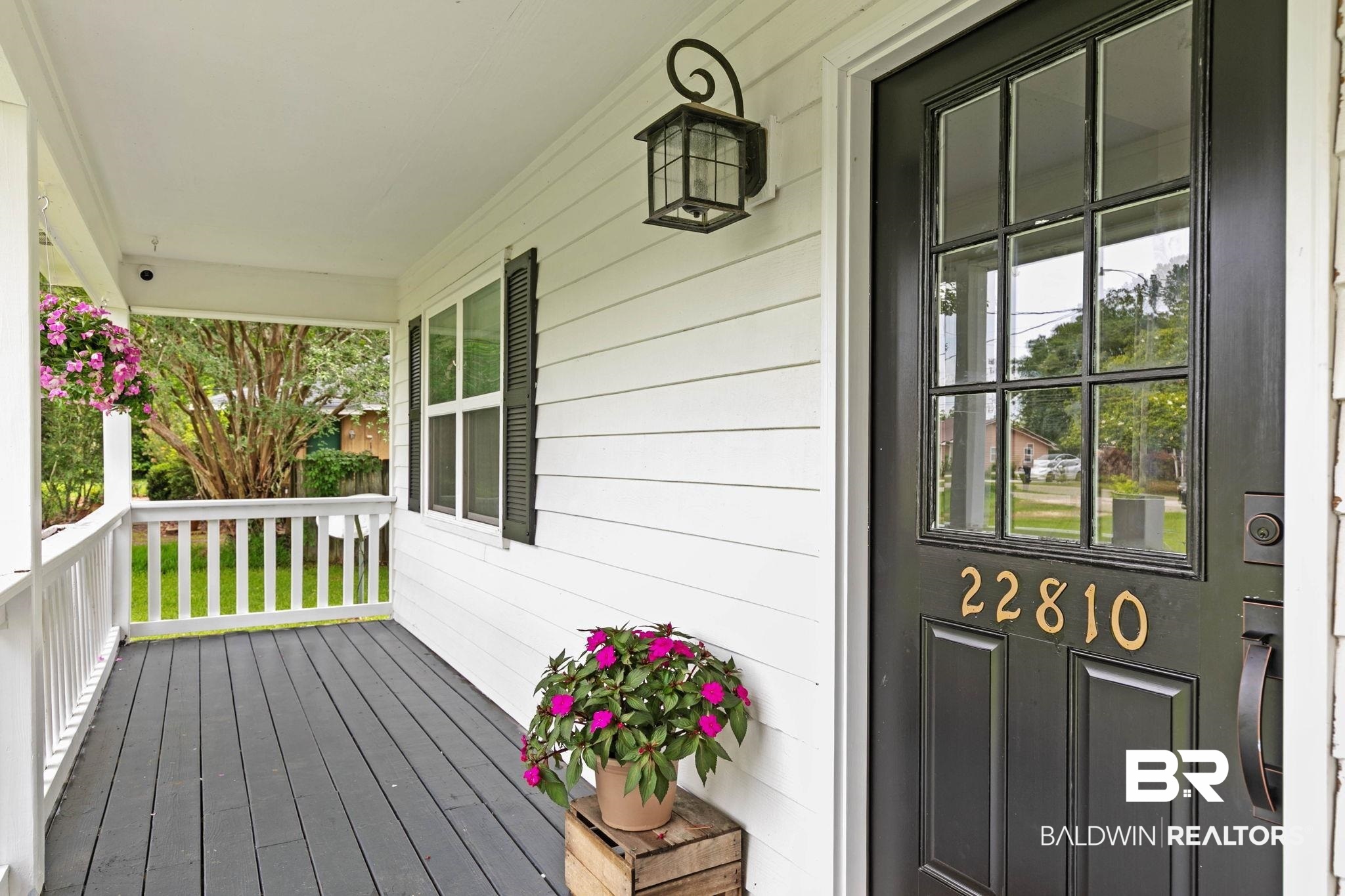 22810 High Ridge Road Fairhope, AL 36532 - Photo 18 of 78 Inviting front porch featuring a dark gray deck, white painted railing, and white siding