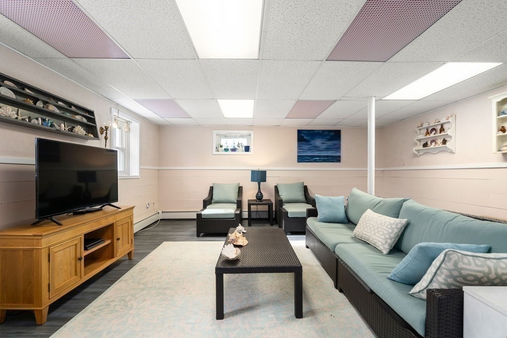 72 Summer Hill Road Maynard, MA 01754 - Photo 29 of 38 a living room with furniture and a flat screen tv
