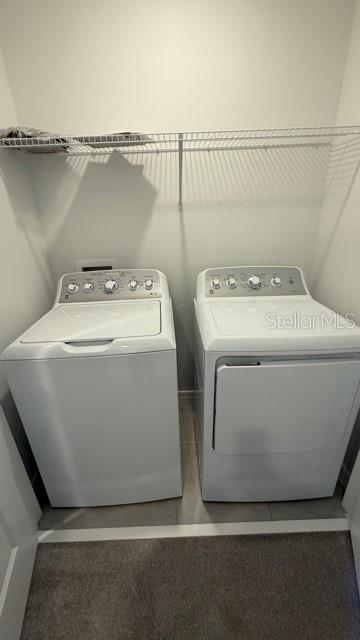 2957 Skyline Loop Kissimmee, FL 34758 - Photo 17 of 23 a utility room with dryer and washer