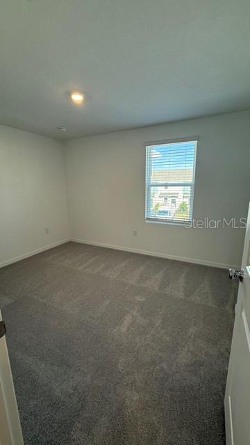 2957 Skyline Loop Kissimmee, FL 34758 - Photo 18 of 23 an empty room with a window