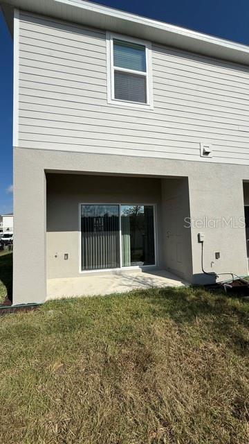 2957 Skyline Loop Kissimmee, FL 34758 - Photo 23 of 23 a front view of a house with a yard and garage