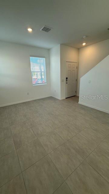 2957 Skyline Loop Kissimmee, FL 34758 - Photo 4 of 23 an empty room with windows