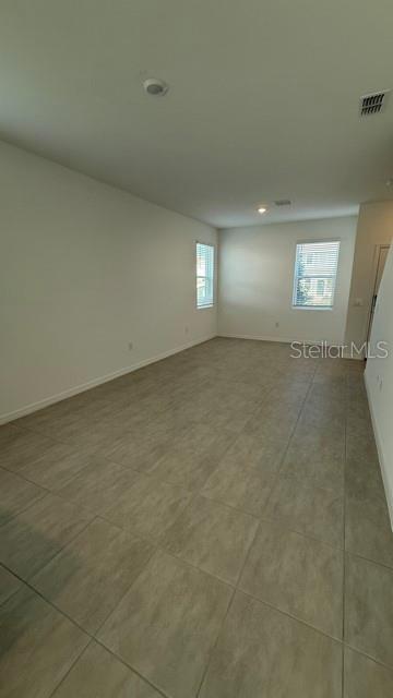 2957 Skyline Loop Kissimmee, FL 34758 - Photo 5 of 23 a view of an empty room with a window