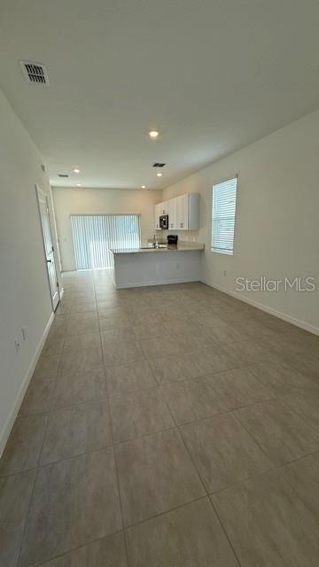 2957 Skyline Loop Kissimmee, FL 34758 - Photo 6 of 23 a view of a kitchen with a sink