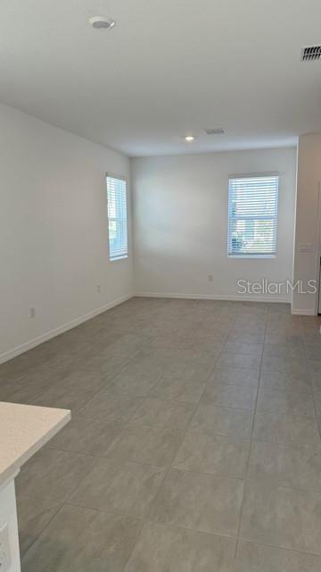 2957 Skyline Loop Kissimmee, FL 34758 - Photo 7 of 23 an empty room with windows