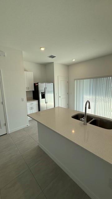 2957 Skyline Loop Kissimmee, FL 34758 - Photo 10 of 23 a view of a kitchen with a sink