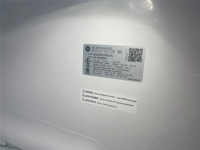 an empty room with a ceiling fan and a window