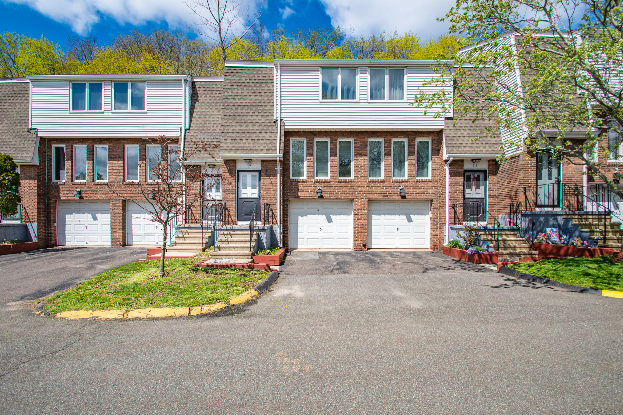 184 Gravel Street, Unit 26 Meriden, CT 06450 - Photo 27 of 27 a front view of a house with a yard and outdoor seating