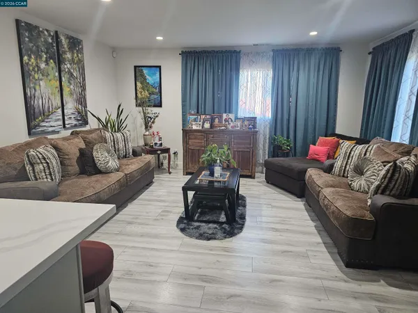 a dining room with furniture and window