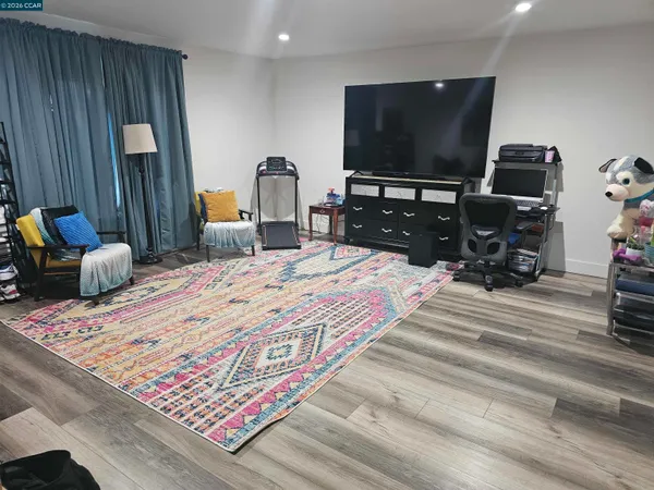 a kitchen with stainless steel appliances granite countertop a stove refrigerator and a stove