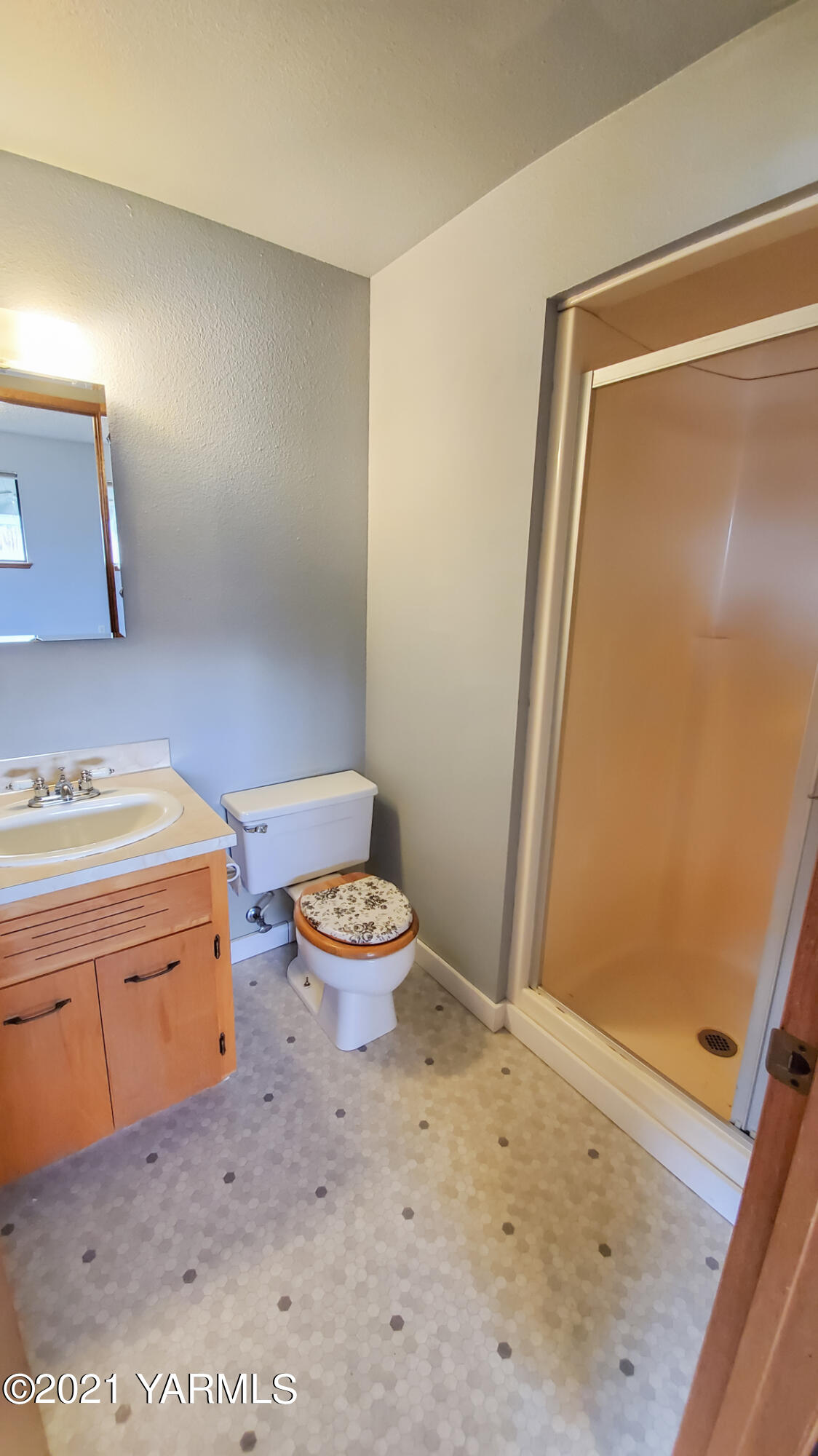 1503 South 27th Avenue Yakima, WA 98902 - Photo 12 of 26 a bathroom with a granite countertop sink toilet and shower