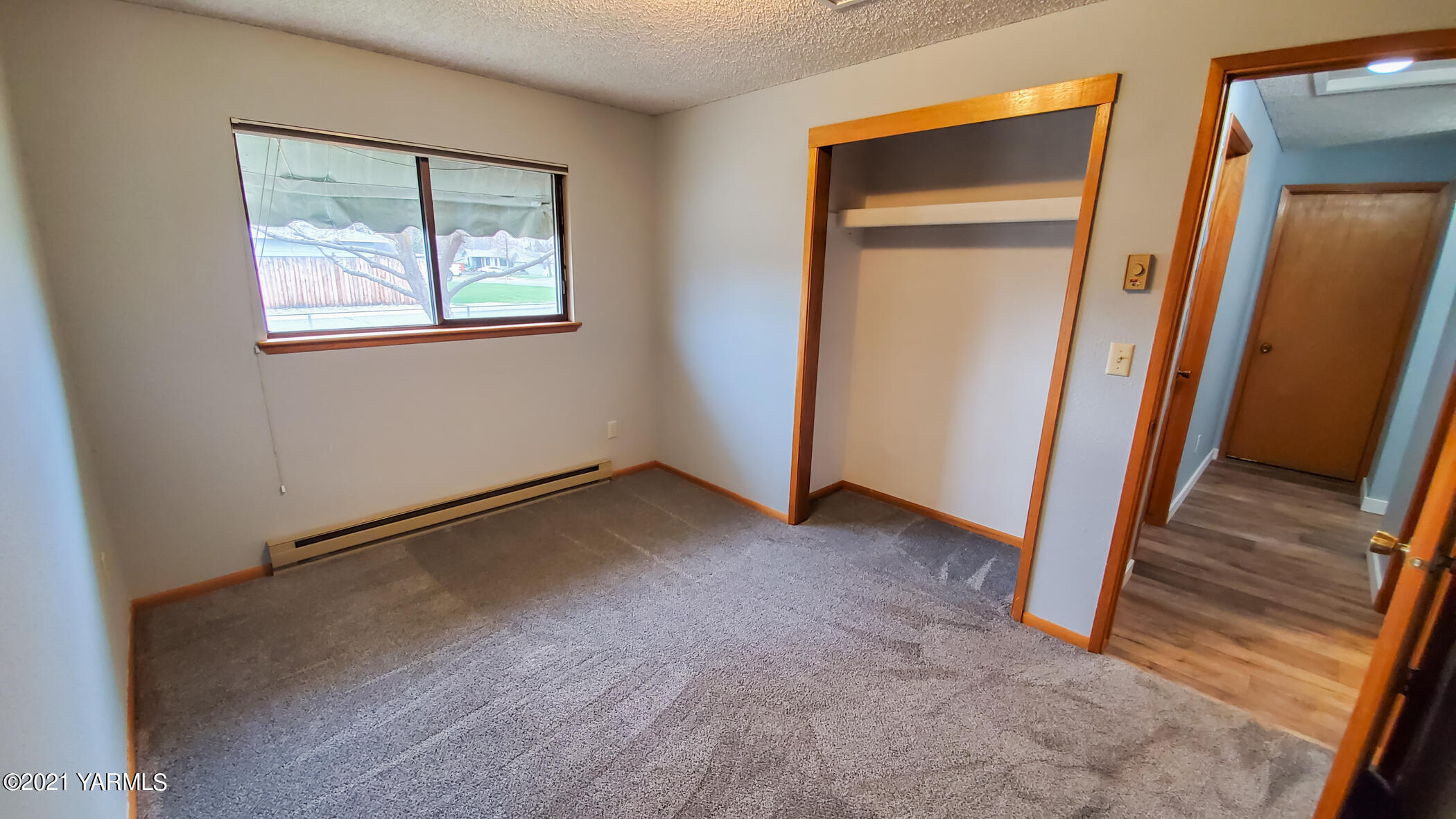 1503 South 27th Avenue Yakima, WA 98902 - Photo 18 of 26 an empty room with windows and closet