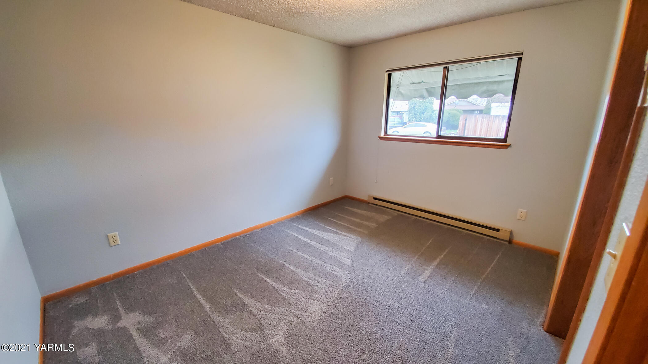 1503 South 27th Avenue Yakima, WA 98902 - Photo 19 of 26 a view of an empty room with a window