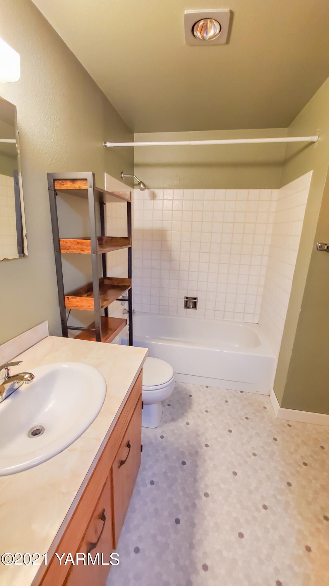 1503 South 27th Avenue Yakima, WA 98902 - Photo 21 of 26 a bathroom with a sink a toilet and shower