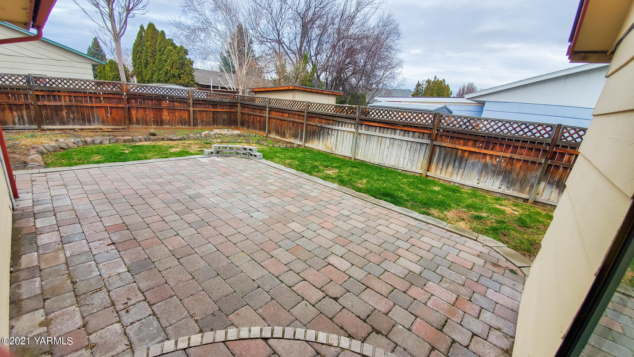 1503 South 27th Avenue Yakima, WA 98902 - Photo 22 of 26 a view of a terrace with yard and wooden fence