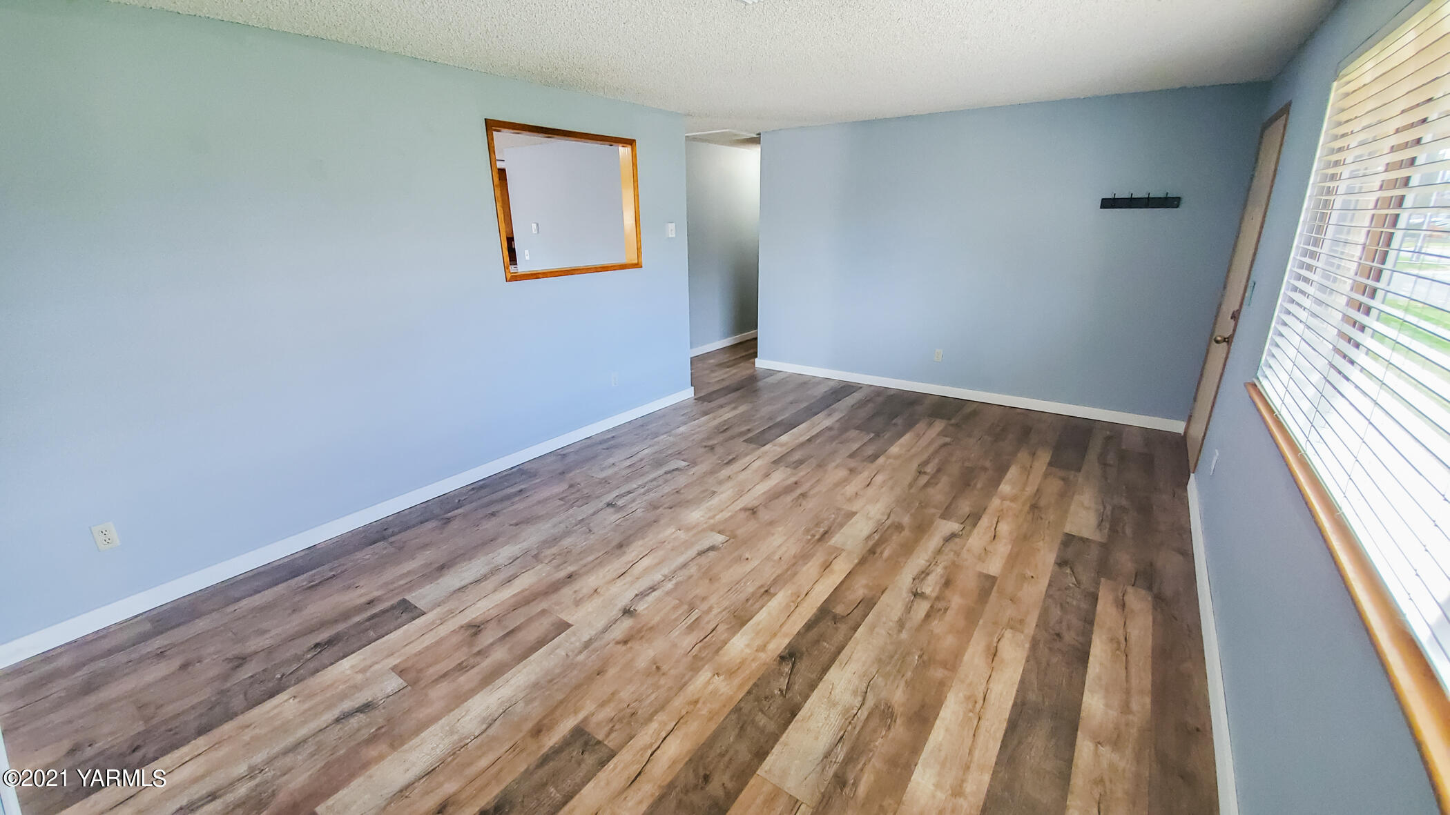 1503 South 27th Avenue Yakima, WA 98902 - Photo 6 of 26 a view of room with wooden floor and window