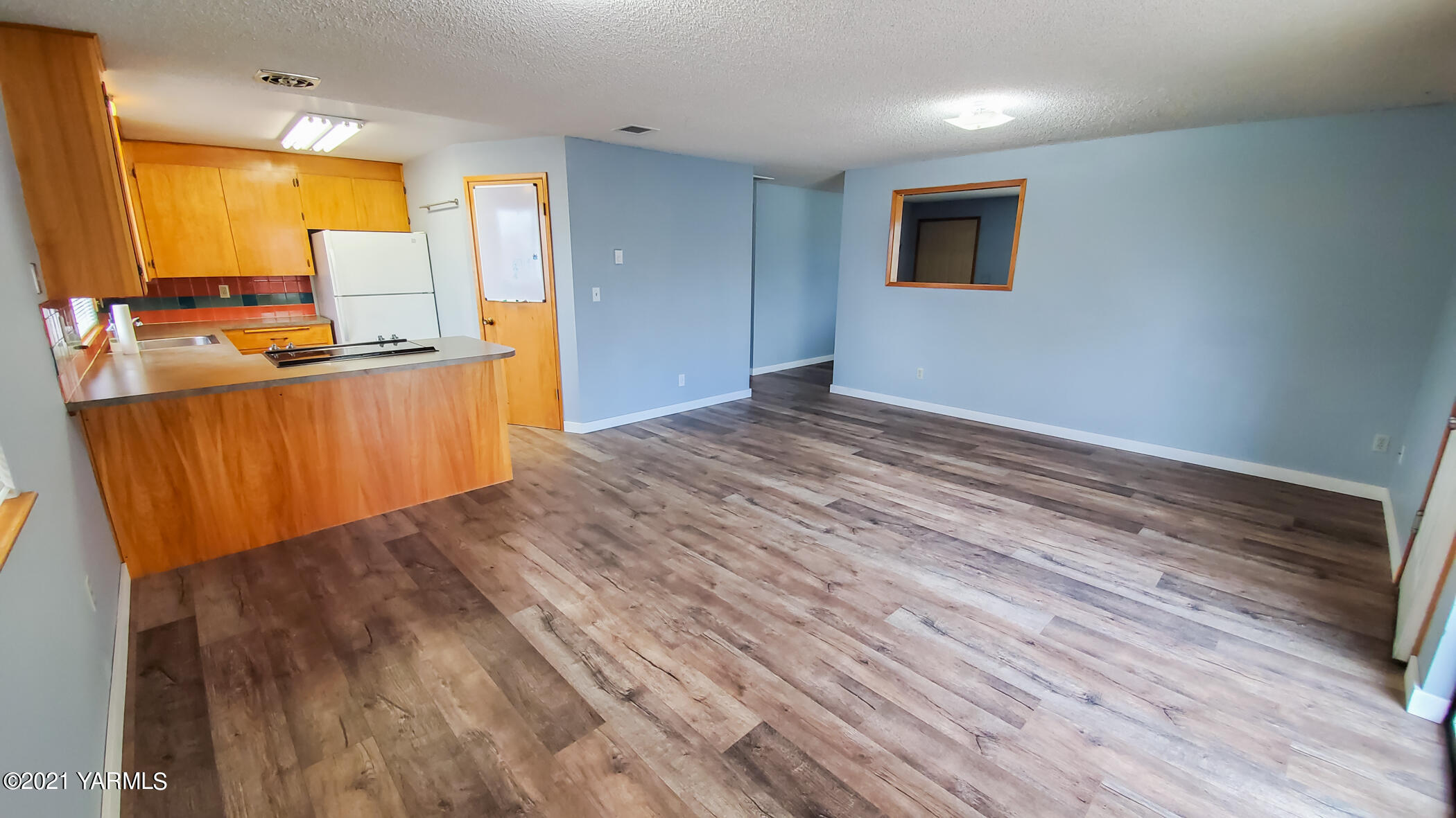 1503 South 27th Avenue Yakima, WA 98902 - Photo 8 of 26 a view of kitchen with wooden floor