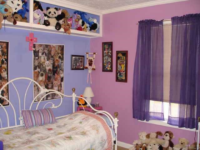 You and your child will love these built-in, overhead storage shelves to help keep their room neat!
