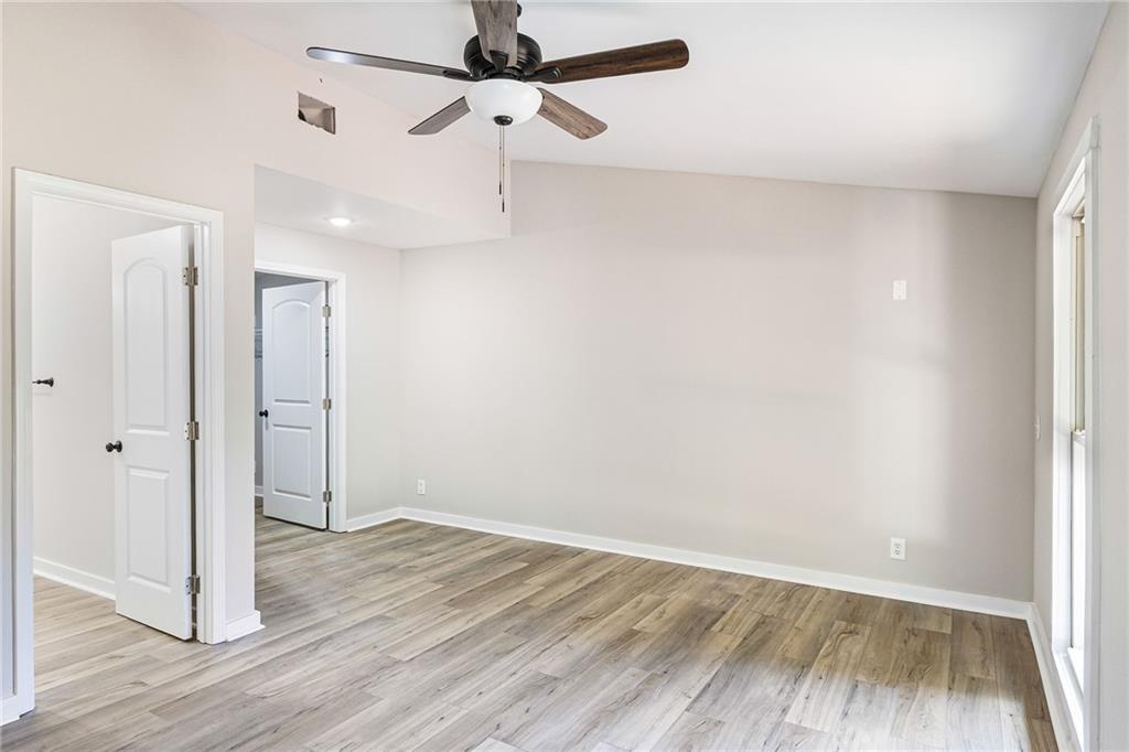 1265 Horsley Mill Road Carrollton, GA 30116 - Photo 13 of 31 wooden floor in an empty room with a window
