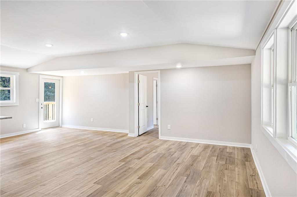 1265 Horsley Mill Road Carrollton, GA 30116 - Photo 20 of 31 wooden floor in an empty room with a window