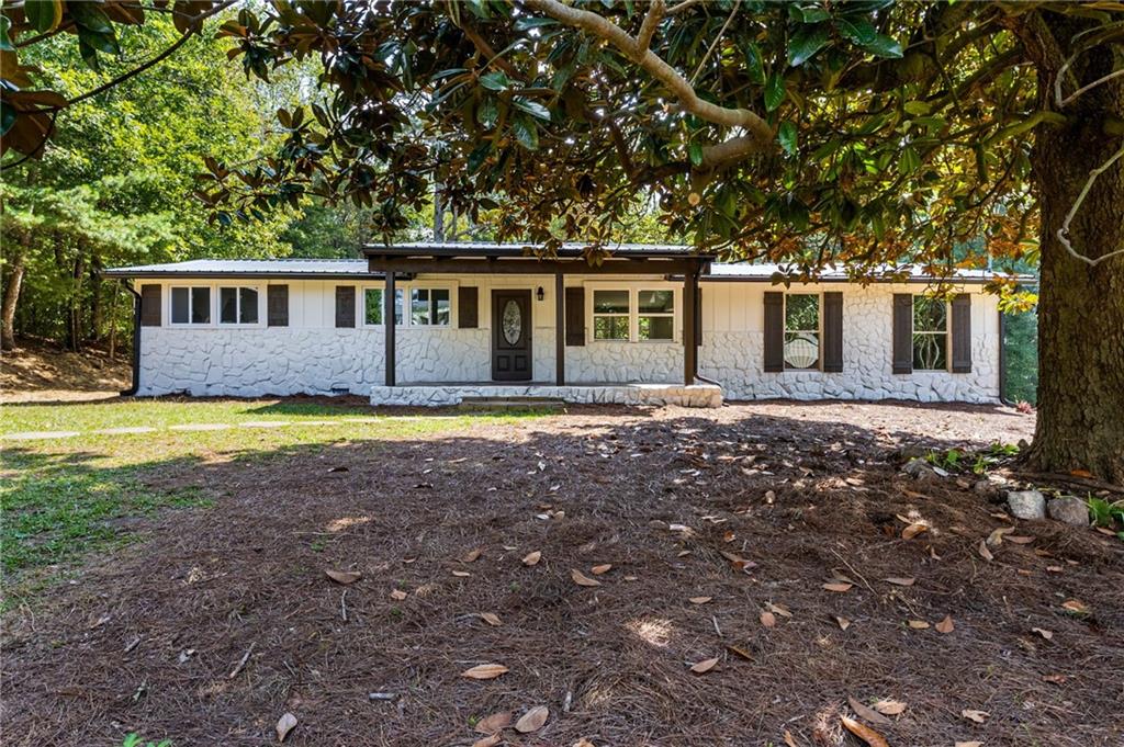 1265 Horsley Mill Road Carrollton, GA 30116 - Photo 2 of 31 a front view of a house with yard and green space