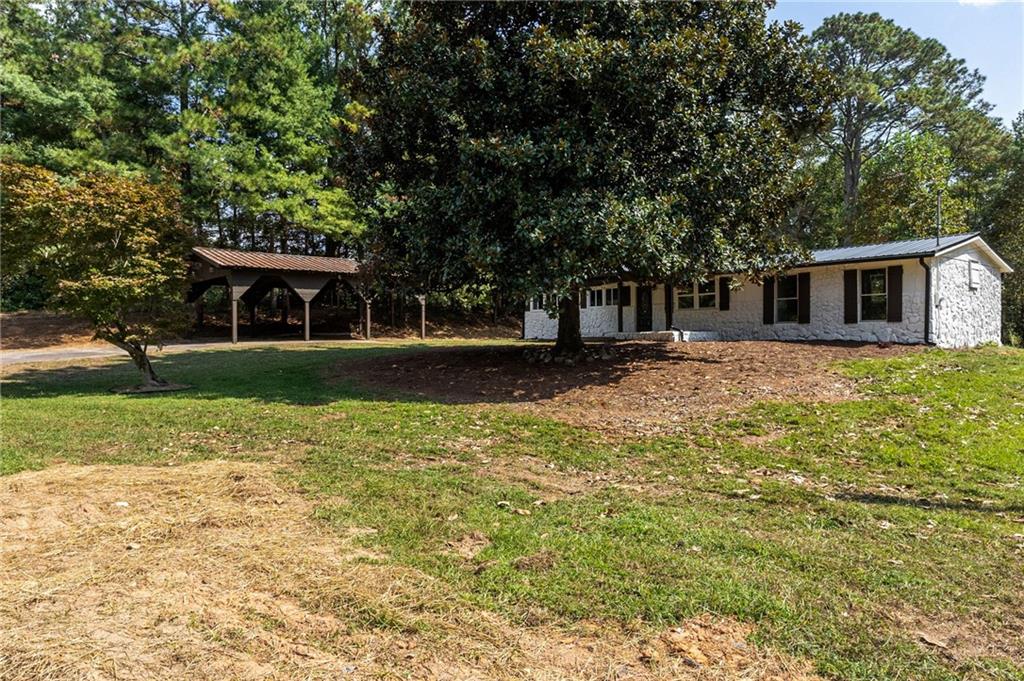 1265 Horsley Mill Road Carrollton, GA 30116 - Photo 29 of 31 a front view of house with yard and green space