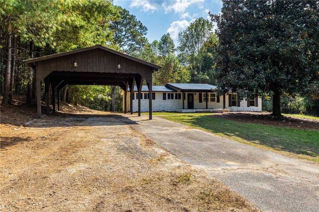 1265 Horsley Mill Road Carrollton, GA 30116 - Photo 30 of 31 a view of a house with a yard