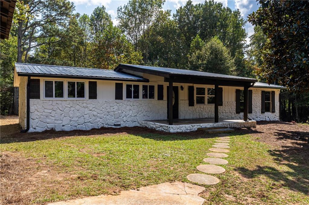 1265 Horsley Mill Road Carrollton, GA 30116 - Photo 3 of 31 a front view of a house with yard and porch