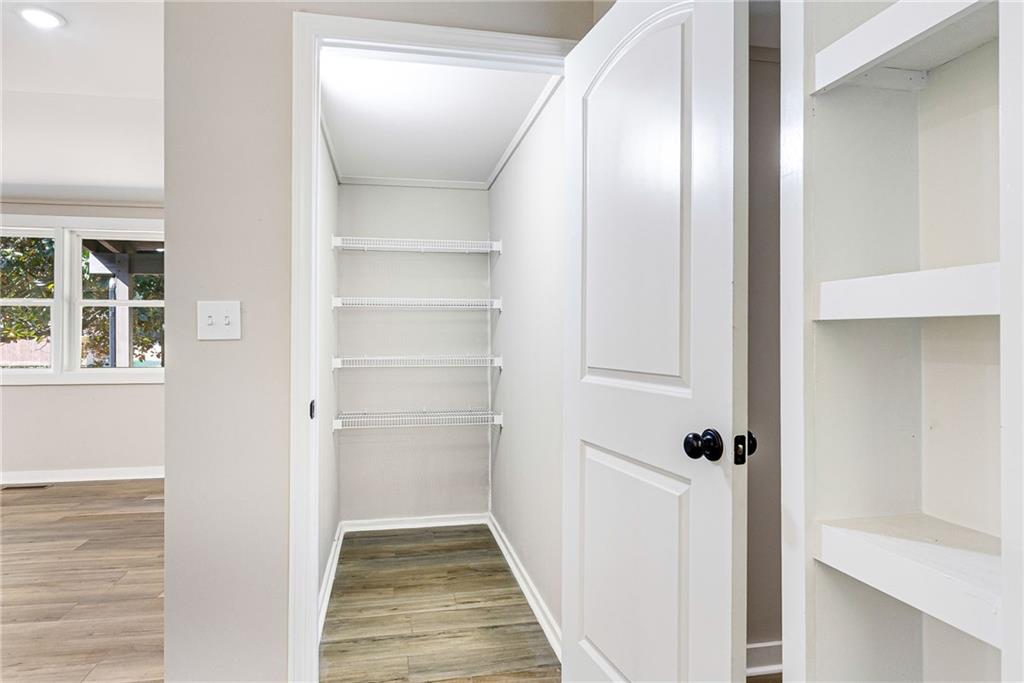 1265 Horsley Mill Road Carrollton, GA 30116 - Photo 4 of 31 a view of a hallway with wooden floor and closet