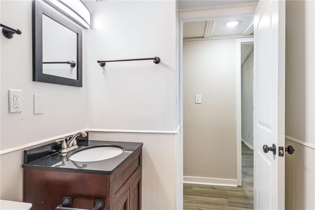 1265 Horsley Mill Road Carrollton, GA 30116 - Photo 8 of 31 a bathroom with a granite countertop sink and a mirror