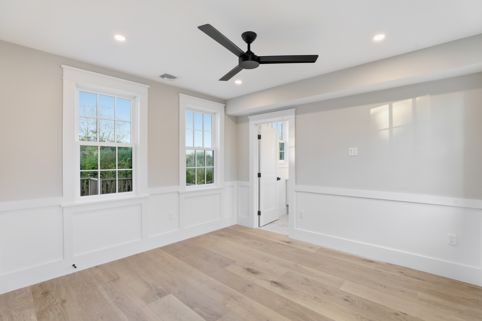 6 Mariner Way Nantucket, MA 02554 - Photo 17 of 31 a view of empty room with wooden floor and fan
