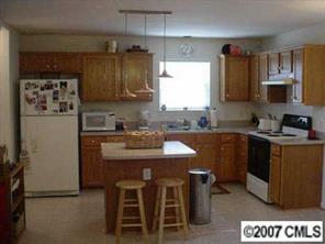 6532 Nevin Road Charlotte, NC 28262 - Photo 7 of 8 a kitchen with a sink cabinets and window