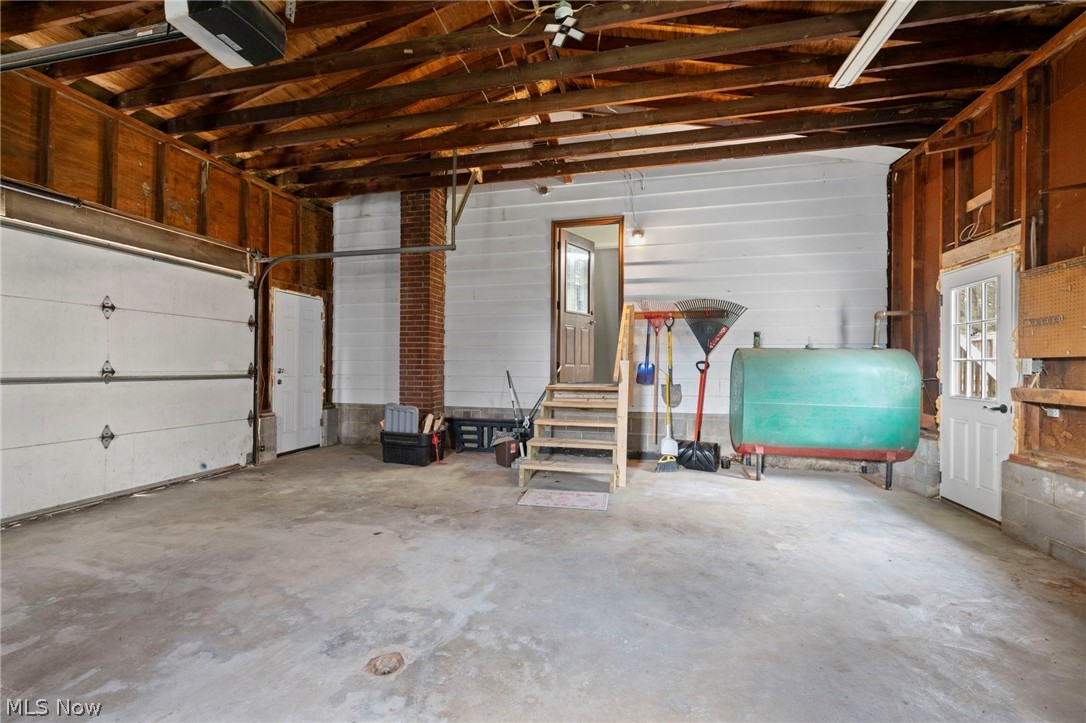 1835 Windham Road Newton Falls, OH 44444 - Photo 26 of 40 Garage featuring oil tank and a garage door opener