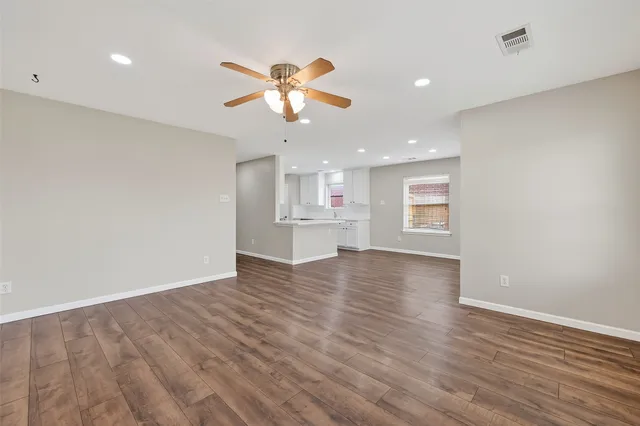 a stove top oven sitting inside of a kitchen