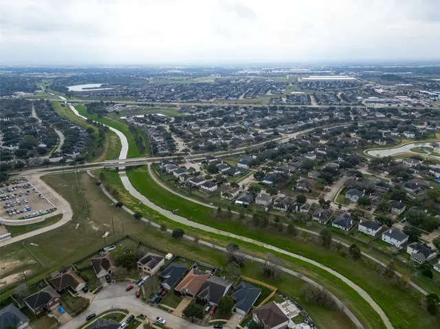 a view of a house with a yard and a garden