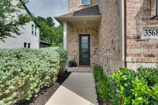 a entryway with flower pots