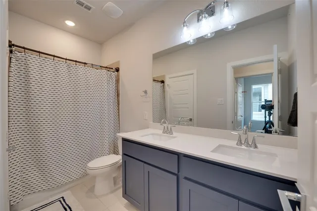 a view of a house with backyard and a tree