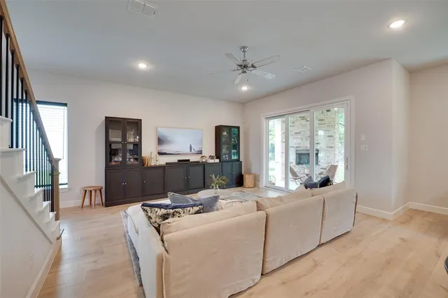 a kitchen with a dining table chairs and cabinets