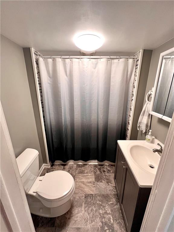 409 1st Street Chestnut Ridge, PA 15422 - Photo 17 of 31 a bathroom with a sink toilet and shower