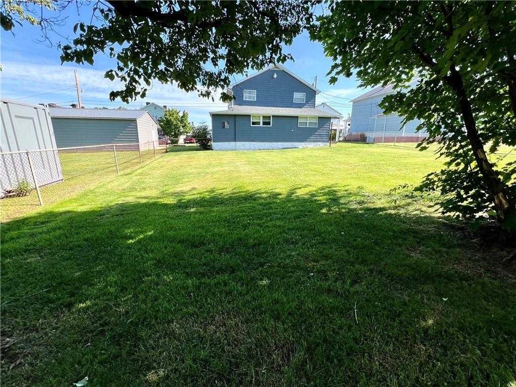 409 1st Street Chestnut Ridge, PA 15422 - Photo 28 of 31 a front view of a house with a yard