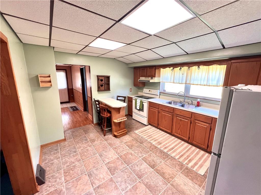 409 1st Street Chestnut Ridge, PA 15422 - Photo 8 of 31 a kitchen with a sink stove and cabinets