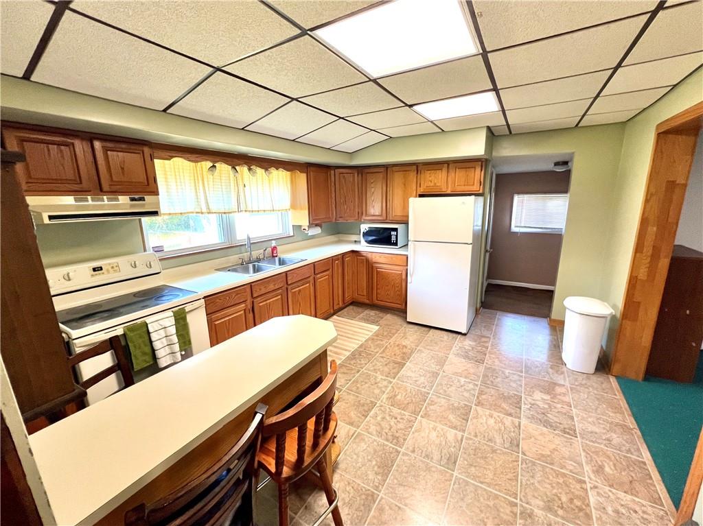 409 1st Street Chestnut Ridge, PA 15422 - Photo 9 of 31 a kitchen with a sink appliances and cabinets