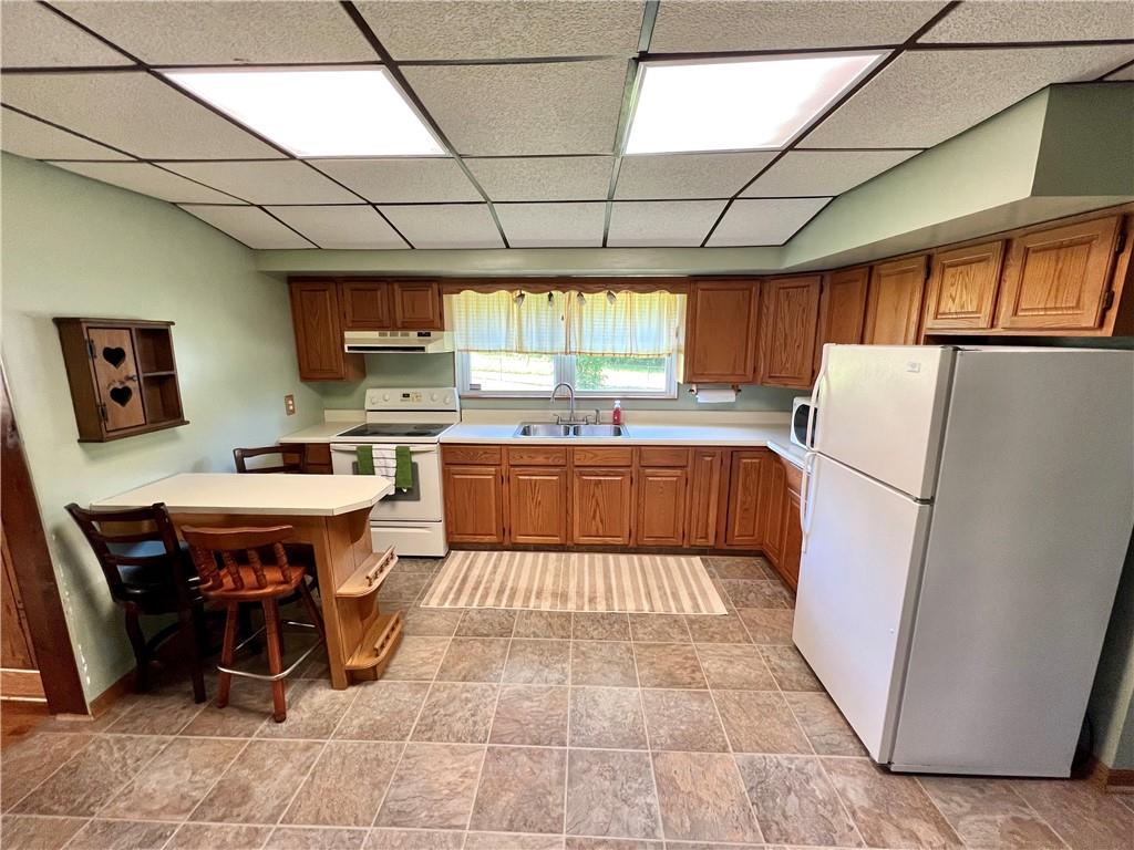 409 1st Street Chestnut Ridge, PA 15422 - Photo 10 of 31 a kitchen with a sink a counter space and a window