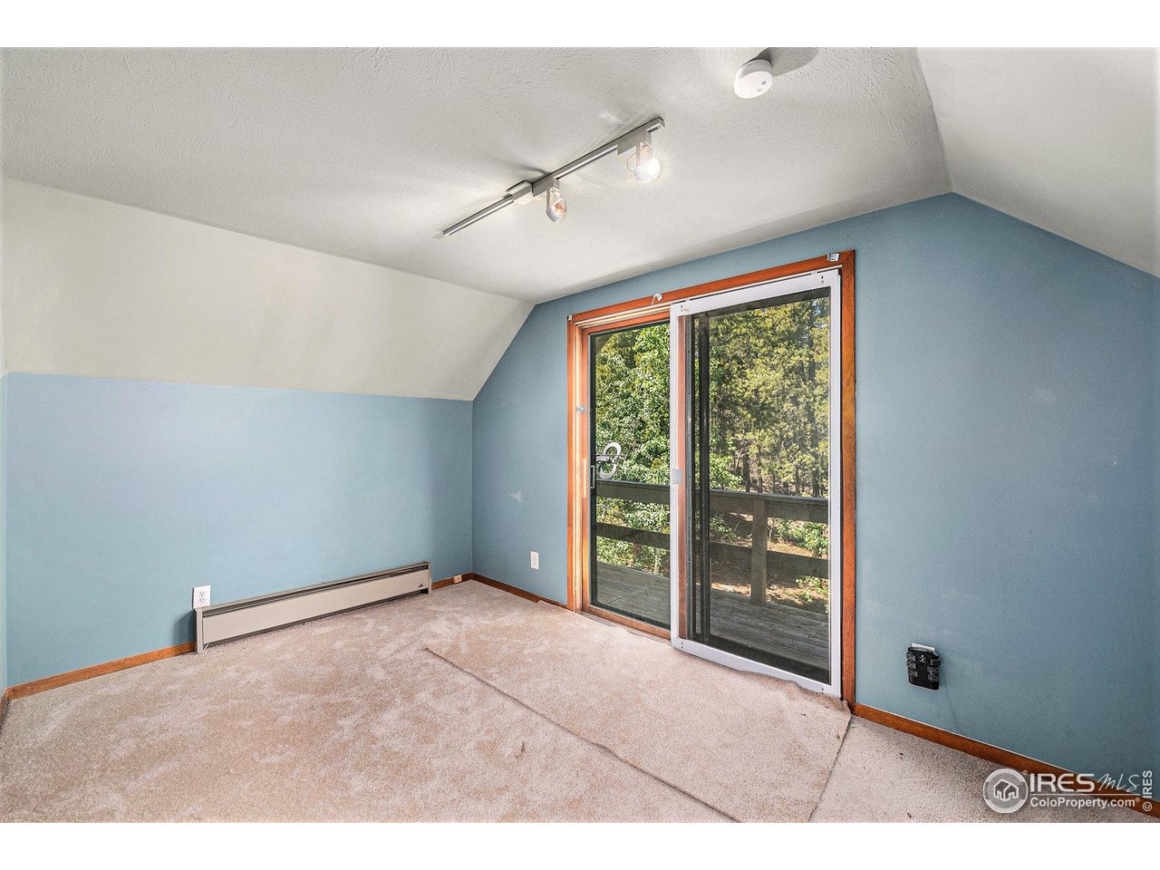 147 St Vrain Trail Ward, CO 80481 - Photo 18 of 31 a view of an empty room with a window