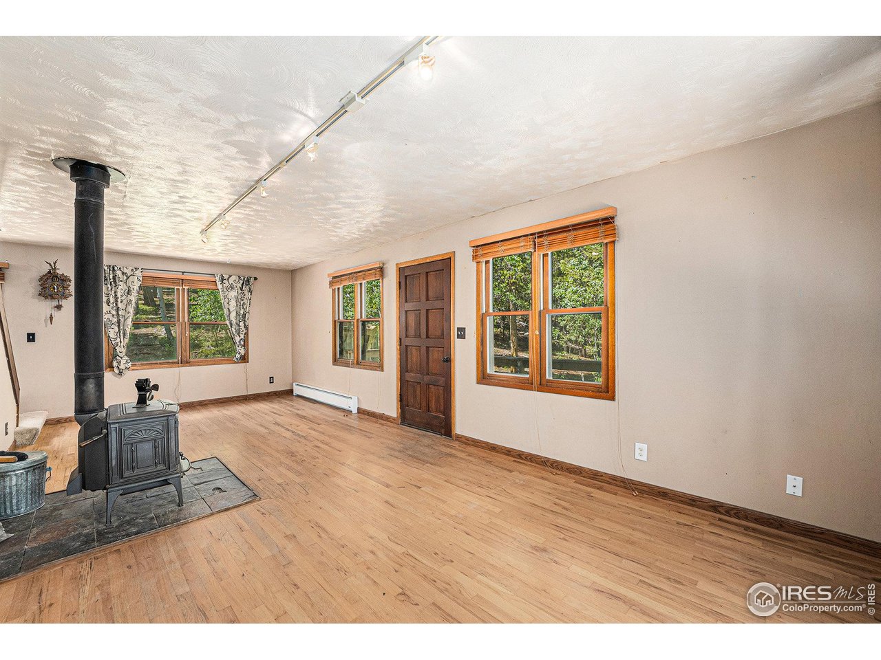 147 St Vrain Trail Ward, CO 80481 - Photo 2 of 31 a view of an empty room with a window