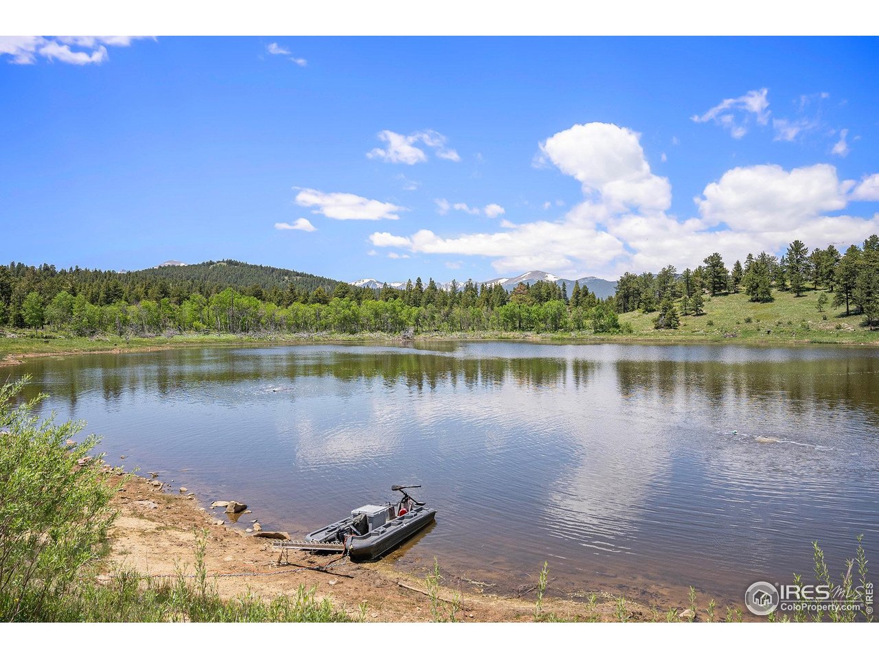 147 St Vrain Trail Ward, CO 80481 - Photo 29 of 31 a view of a lake in between two and trees